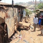 Kibera, Nairobi, Kenya - February 13, 2015: a street in slums with poor huts